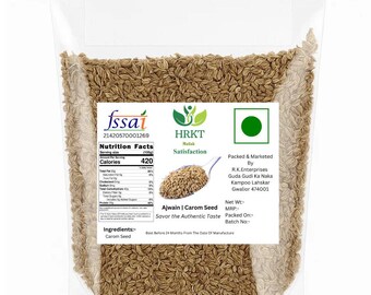 May include: A clear plastic bag filled with carom seeds. The bag has a white label with text including "fssai", "Nutrition Facts", and "Ajwain | Carom Seed". The label also features a green logo and the words "Savor the Authentic Taste".
