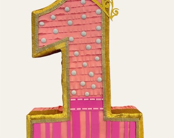 Hermosa piñata rosa con Dorado para la fiesta del cumpleaños