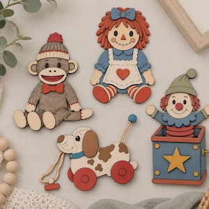 May include: Four flat wooden cutouts featuring a sock monkey in a hat, a rag doll with red yarn hair, a pull-toy dog with brown spots and red wheels, and a clown popping out of a blue jack-in-the-box with a yellow star and a side crank handle.