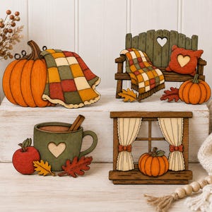 May include: A set of four decorative wooden cutouts featuring a large orange pumpkin with a plaid blanket, a green bench with a heart cutout and plaid blanket, a green mug with a heart and cinnamon stick, and a window frame with curtains and a pumpkin.