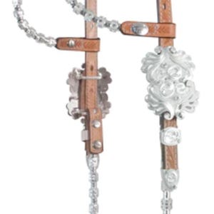 May include: A Western-style horse bridle with a light brown leather base. The bridle features silver-colored decorative accents, including floral designs and chains. The cheek pieces and browband are adorned with silver embellishments.
