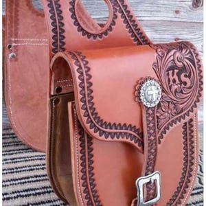 Leather saddle bag colour brown and hand tooled
