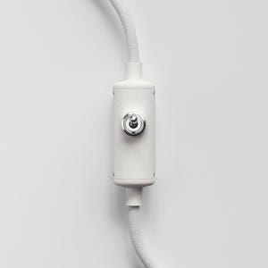 May include: White cord with a white on/off switch with a silver knob.