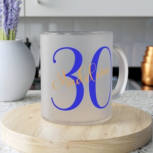 May include: A frosted glass mug with a blue number 30 and the name "Madeleine" in gold lettering.