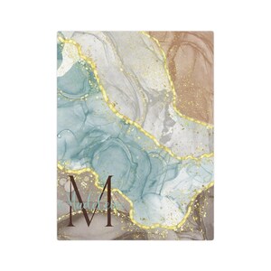 May include: Abstract art print with a blue, grey, and brown background with gold accents. The letter "M" is in the bottom left corner.