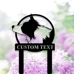 May include: Black metal garden stake featuring a silhouette of a Border Collie dog's head inside a circle. The stake has a rectangular sign that says "CUSTOM TEXT".