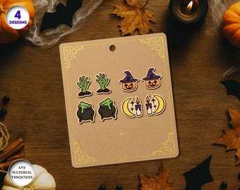 May include: A set of Halloween-themed stickers on a brown card. The stickers include green zombie hands, jack-o'-lanterns with purple hats, black cauldrons with green bubbling liquid, and crescent moons with candles. The card has gold decorative corners and the text "4 Designs".