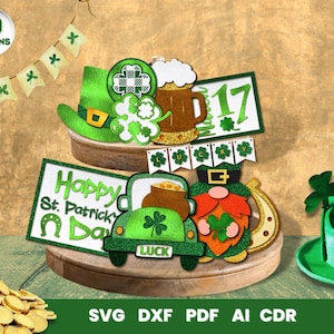 May include: Ten St. Patrick's Day themed digital cut files, including a leprechaun, a pot of gold, a shamrock, a beer mug, a hat, a horseshoe, a truck, a banner, and a sign that says "Happy St. Patrick's Day".