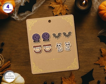 May include: A set of Halloween-themed stickers on a brown card. The stickers include designs of crystal balls, bats, vampire teeth, and skeleton cats. The card has a gold border and the text "4 Designs".