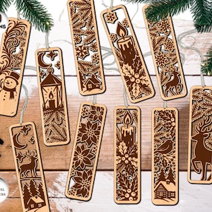 Peut inclure: Dix marque-pages en bois avec des motifs découpés au laser. Chaque marque-page présente un design différent sur le thème de l'hiver ou des fêtes, comme un bonhomme de neige, une bougie, un cerf et une maison. Les marque-pages sont en bois clair et ont une ficelle.