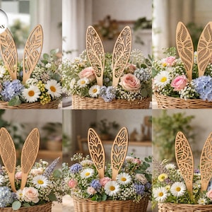 May include: Six floral arrangements in woven baskets, each featuring wooden bunny ears with intricate designs. The arrangements include daisies, roses, and hydrangeas in various colors, creating a spring or Easter theme.