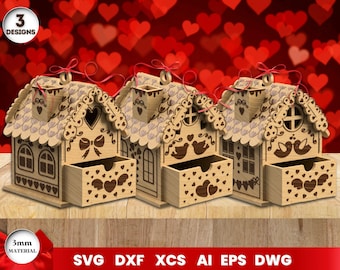 Puede incluir: Tres diseños de casas de madera recortadas con cajones. Cada casa tiene una ventana en forma de corazón y un cajón en forma de corazón. Las casas están decoradas con corazones y pájaros. El texto "3 DESIGNS" está en la esquina superior izquierda de la imagen.