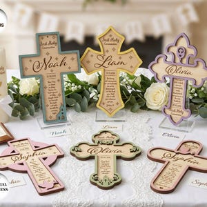 May include: Six decorative wooden crosses for First Holy Communion, each featuring a unique shape and color border including teal, yellow, purple, pink, green, and brown. Each cross is personalized with a name and date, and includes text.