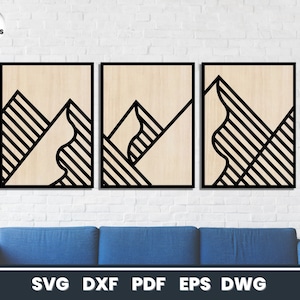 May include: Three black framed wood wall art prints with geometric mountain designs. The designs are made up of black and white stripes.