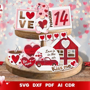 May include: A collection of Valentine's Day themed wooden decorations. Includes a gnome, hearts, a house, a truck, and the words "Love", "February 14", "Be Mine", "Love is in the air", and "Kiss me". The image also includes the text "10 Designs".