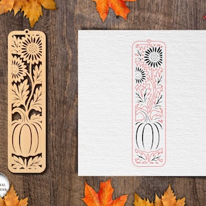 May include: Wooden bookmark with a laser-cut design featuring sunflowers and a pumpkin. The bookmark is light brown and has a rectangular shape with a hole at the top. The design is intricate and detailed, perfect for fall or autumn-themed gifts.