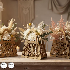 May include: Three wooden decorative flower baskets with intricate cut-out designs, each filled with dried flowers and greenery. The baskets have a handle and are displayed on a wooden surface. The text "DIGITAL PRODUCT" is in the upper left corner.