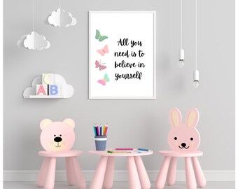 May include: A children's room scene featuring a framed print with the text "All you need is to believe in yourself" and butterfly illustrations. Pink bear and bunny chairs surround a small table with art supplies.
