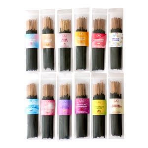 May include: An assortment of incense sticks in clear plastic packaging. Each bundle has a different colored label with a unique scent name, including "Cotton Candy," "French Toast," and "Strawberry Shortcake."