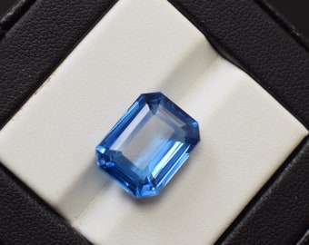 11,25 kt. Lab Grown London Blue Topaas, smaragd geslepen, losse edelsteen, 14 x 12 x 6 mm