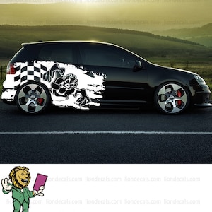 May include: Black car with a white checkered flag and a cartoon character graphic on the side. The graphic is a black and white illustration of a cartoon character with a mischievous expression. The car is on a gray asphalt surface.