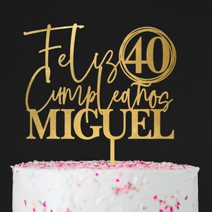 May include: Gold cake topper with the text "Feliz Cumpleanos Miguel" and the number "40" in a circle.