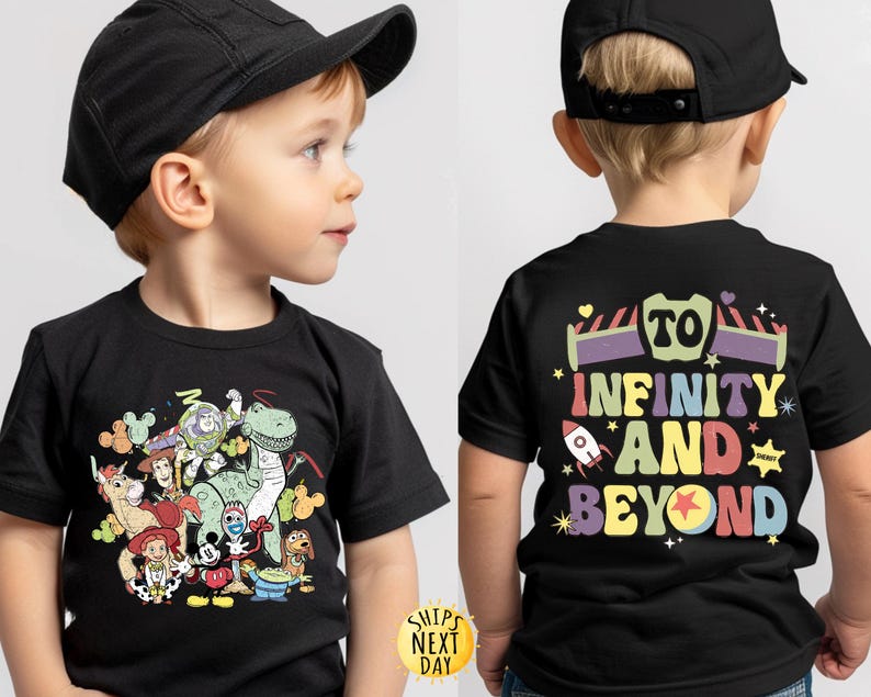 May include: Black t-shirt featuring a colourful graphic of Toy Story characters, including Woody, Buzz Lightyear, Rex, and a unicorn. The back of the shirt has the text "To Infinity and Beyond" in a rainbow font.