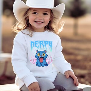 May include: A set of three ceramic mugs with a speckled, matte finish in cream, light grey, and dark grey. Each mug has a simple, minimalist design and a rounded handle.