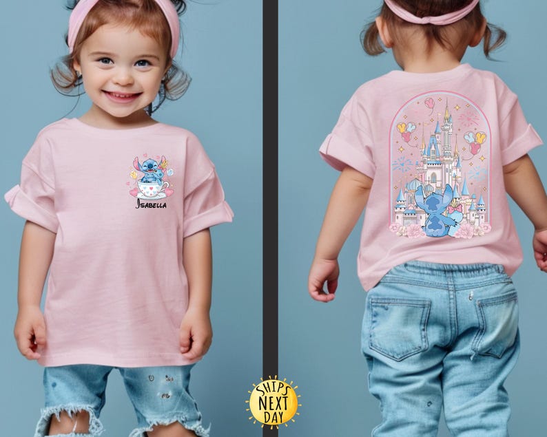 May include: Pink t-shirt featuring a cartoon Stitch design on the front and back. The front design shows Stitch in a teacup with the name "Isabella". The back design features Stitch in front of a castle with fireworks and balloons.