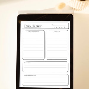 May include: A digital daily planner on a tablet screen. The planner has sections for today's appointments, things to do, reminders, and a section for things you are grateful for. The planner also has a section for the date and days of the week.