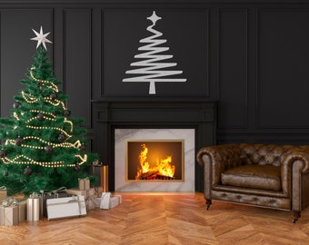 May include: A decorated Christmas tree with lights and ornaments sits in front of a fireplace with a roaring fire. A brown leather armchair sits to the right of the fireplace. The room is decorated with black walls and white trim.