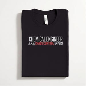 May include: A black crew neck t-shirt featuring white and red text that reads CHEMICAL ENGINEER A.K.A CHAOS CONTROL EXPERT. The shirt has a white brand label inside the collar and is folded neatly to display the graphic on the front center.