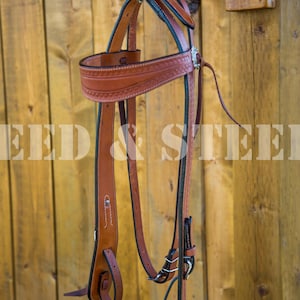 Heavy duty tooled leather  western headstall with straight browban and cochos with tessel.