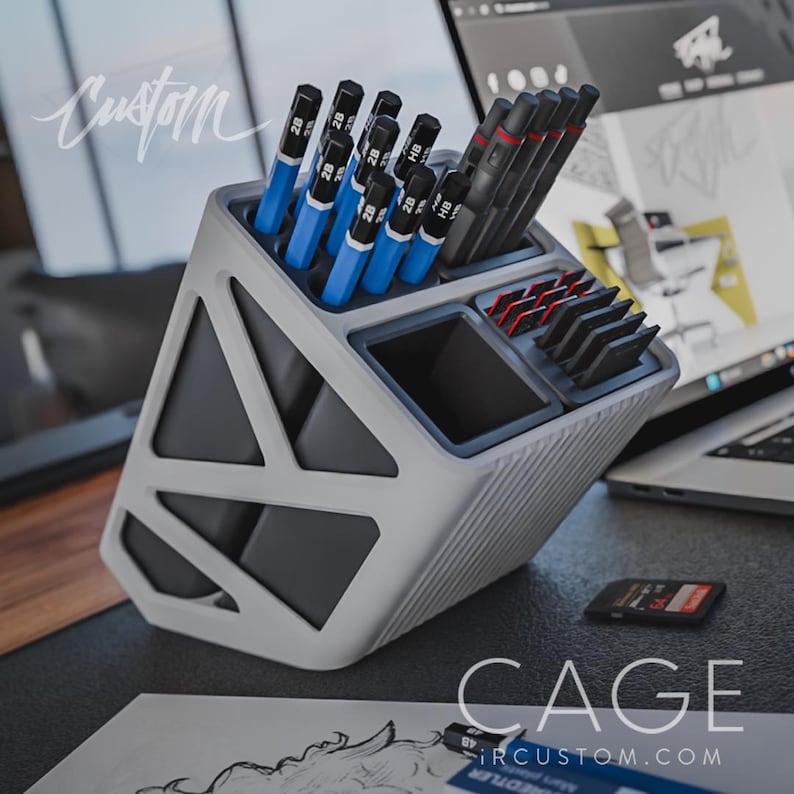 May include: A white and grey geometric desk organiser with multiple compartments for pens, pencils, and other office supplies. The organiser is labelled "CAGE" and "IRCUSTOM.COM".