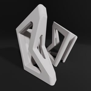 May include: White geometric sculpture with a triangular shape and a cutout design. The sculpture has the text "REMARKABLE" inscribed on it.