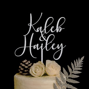 A silver glitter cake topper