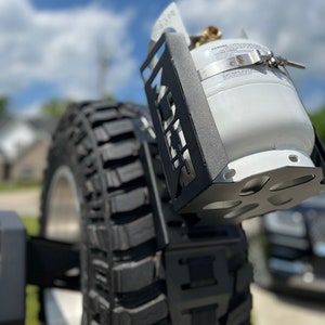 Propane tank mounting bracket and propane tank not included. Shown as an example of mounting options.
