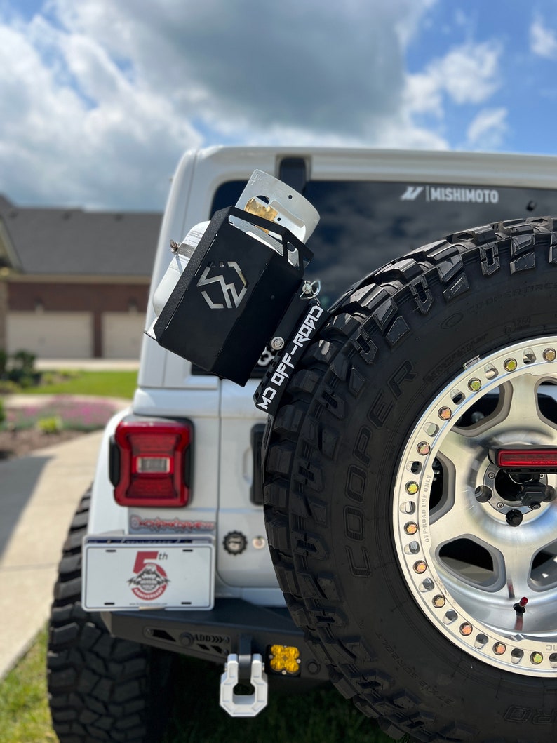 Propane tank mounting bracket and propane tank not included. Shown as an example of mounting options.