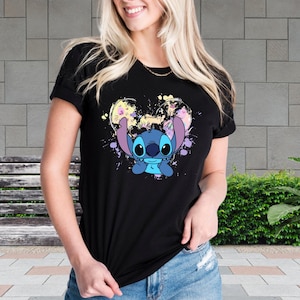 a woman wearing a t - shirt with a stitching stitch stitch stitch stitch stitch