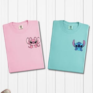 a pair of t - shirts with stitching on them