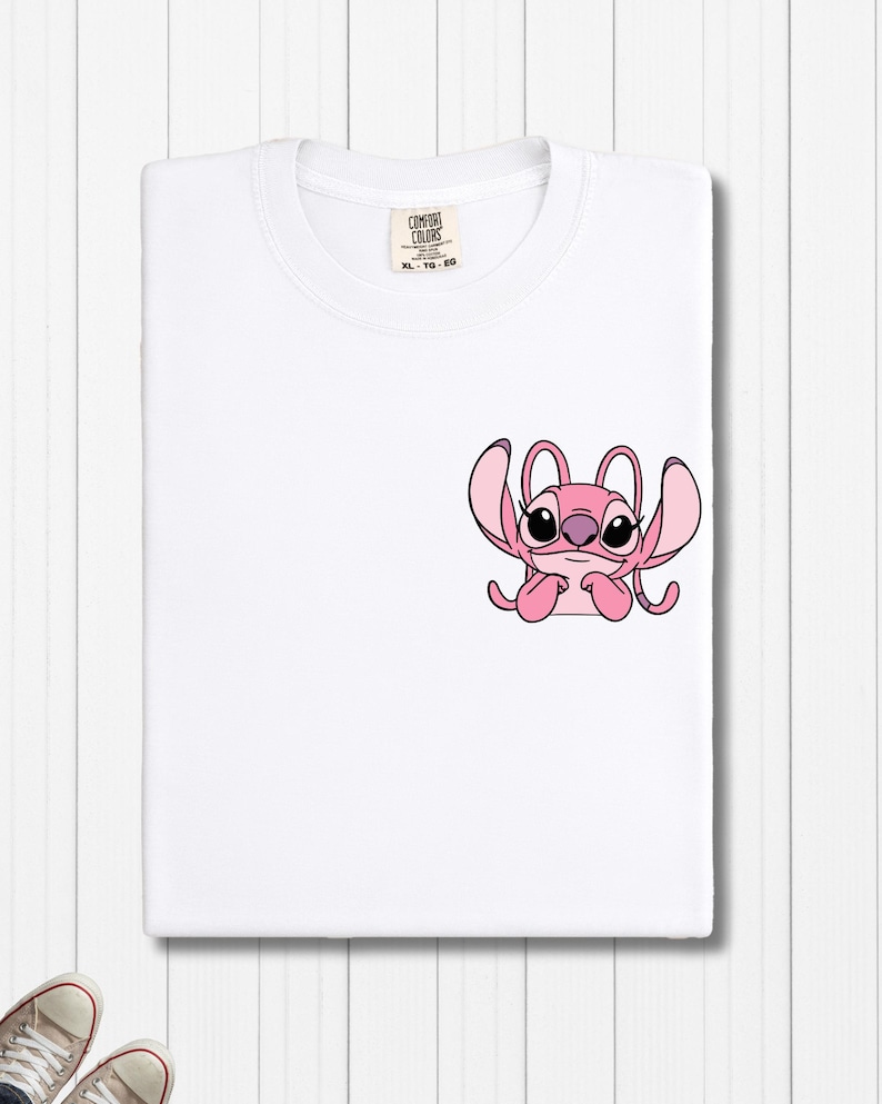 a white t - shirt with a pink octopus on it