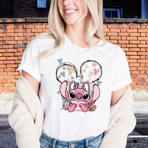 a woman standing in front of a brick building