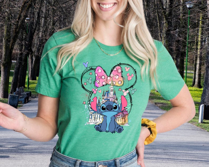 a woman in a green shirt is holding a banana