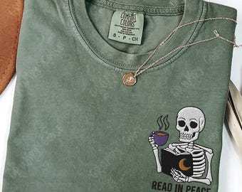 Embroidered Skeleton Book shirt, Read In Peace comfort colors , Gift for book lover, Skull Spooky Season Reading shirt Fantasy Book merch