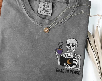 Embroidered Skeleton Book shirt, Read In Peace comfort colors , Gift for book lover, Skull Spooky Season Reading shirt Fantasy Book merch