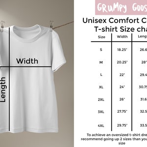 May include: A white Comfort Colour t-shirt hanging on a clothesline. The image includes a size chart with measurements in inches for sizes S to 4XL. The chart provides width and length dimensions for each size, along with the text "GRUMPY GOOSE".