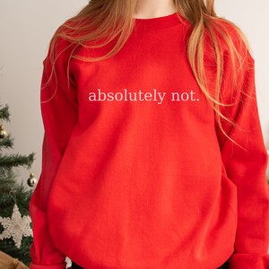 May include: Red sweatshirt with the text "absolutely not." printed in white.