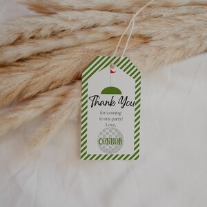 May include: Green and white striped thank you tag with a golf ball design and the text "Thank You for coming to my party! Love, Connor".