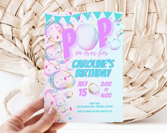 May include: A pink and blue birthday party invitation with a bubble theme. The invitation says "Pop on over for Caroline's Birthday" with a date and time of July 15th from 2:00 to 4:00. The invitation also includes the host's name and address, as well as an RSVP number.