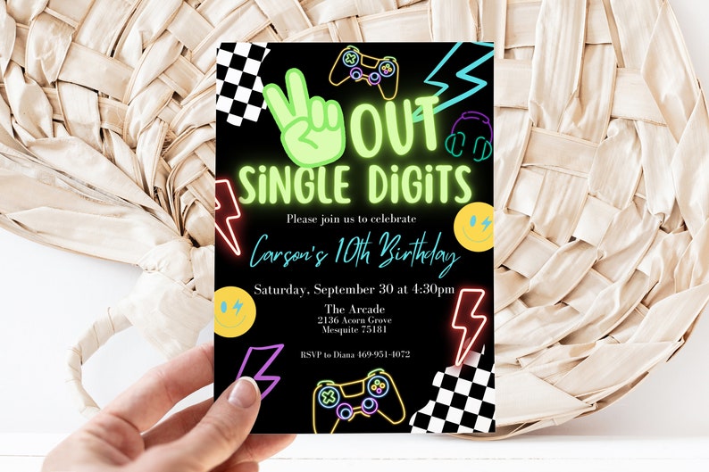 May include: Neon green, pink, and blue birthday party invitation with the text "OUT SINGLE DIGITS" and "Carson's 10th Birthday". The invitation also includes a video game controller, lightning bolts, and a checkered pattern.